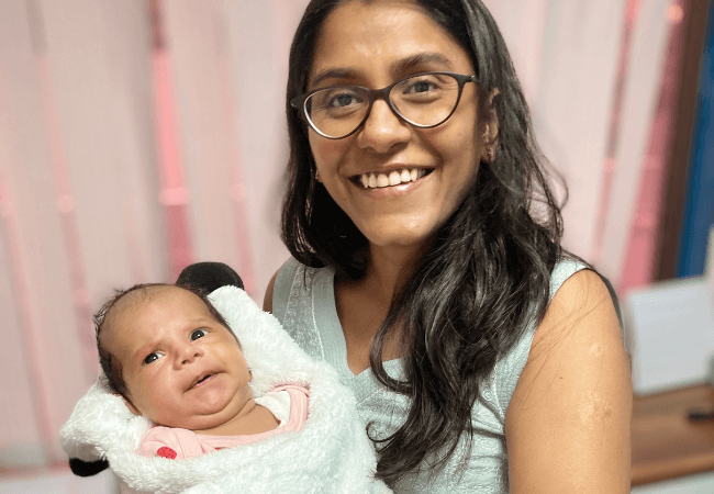 Dr Harsha V Reddy with a new born baby